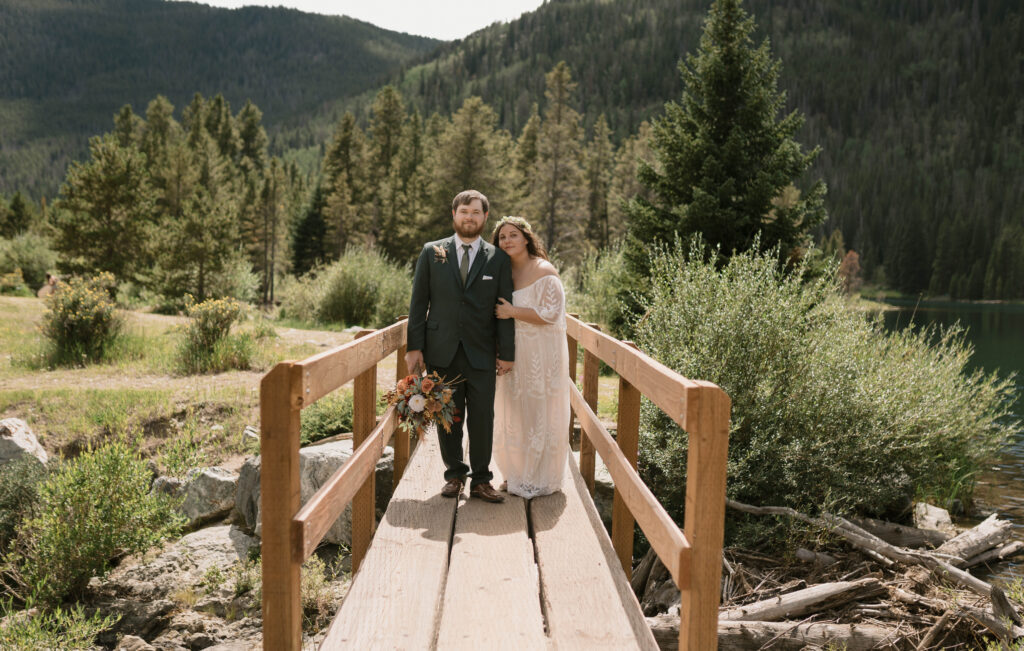 A couple holds each at their elopement at Officer's Gulch near Frisco, Colorado 