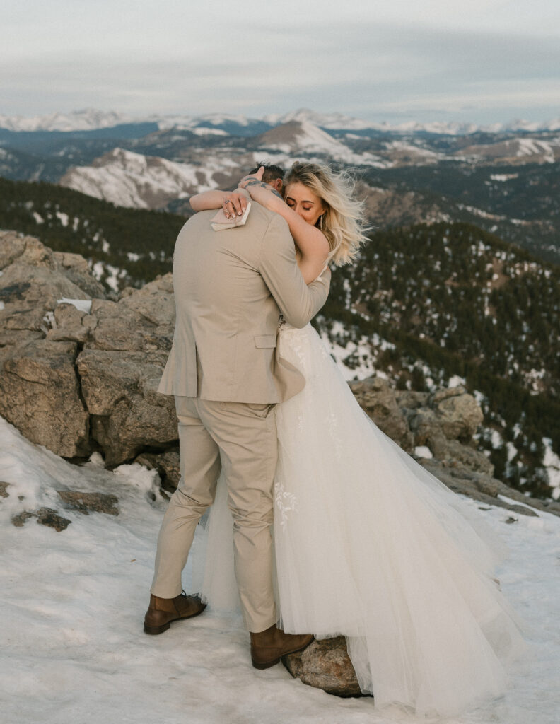 A couple hugs after saying their vows at their elopement at Lost Gulch Lookout near Boulder, Colorado 