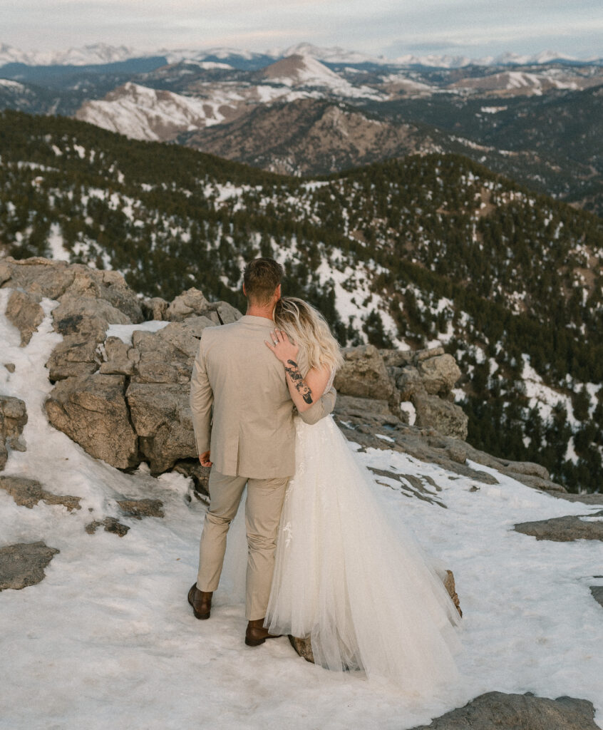 A couple holds each other after saying their vows at their elopement at Lost Gulch Lookout near Boulder, Colorado 