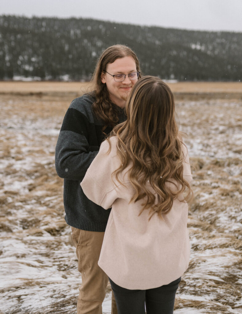 A dreamy engagement session during a spring snow storm at Moraine Park in Rocky Mountain National Park. Candid and documentary engagement photos in Estes Park, Colorado. 
