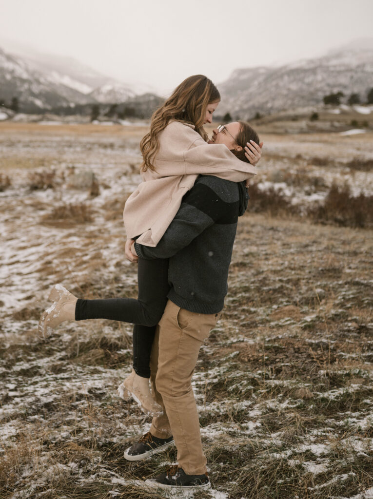 A dreamy engagement session during a spring snow storm at Moraine Park in Rocky Mountain National Park. Candid and documentary engagement photos in Estes Park, Colorado. 