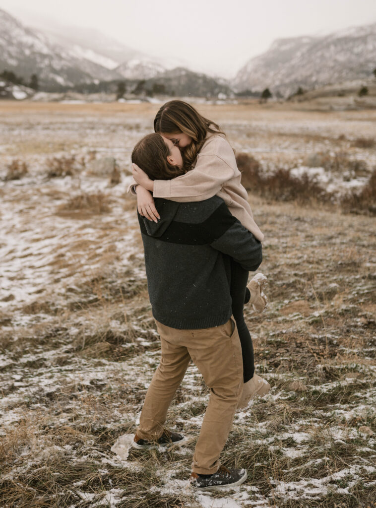 A romantic engagement session during a spring snow storm at Moraine Park in Rocky Mountain National Park. How to get a photography permit in Rocky Mountain National Park.