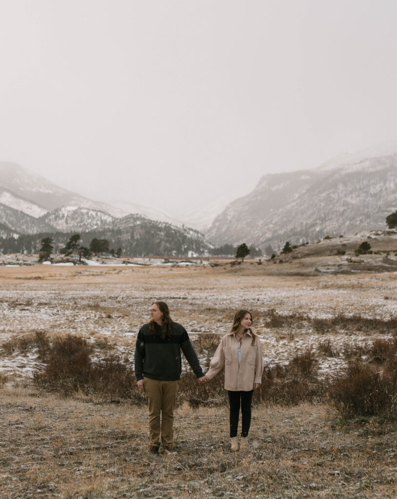 A romantic engagement session during a spring snow storm at Moraine Park in Rocky Mountain National Park. How to get a photography permit in Rocky Mountain National Park.