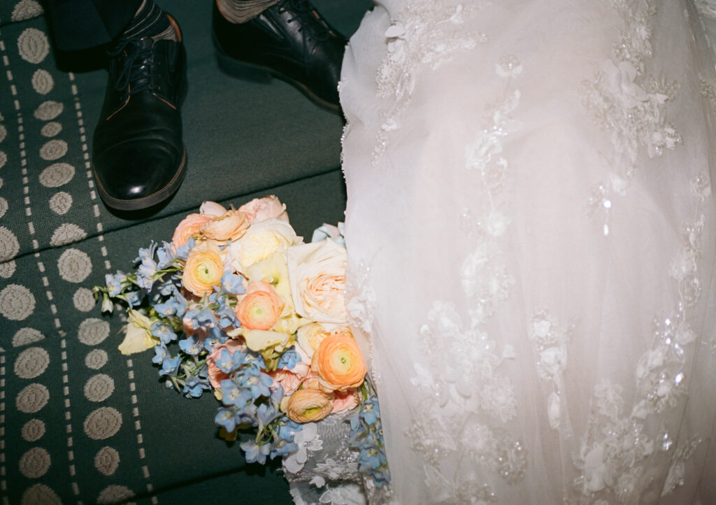 A bride and groom on 35mm film with flash at their wedding. Discover editorial and timeless wedding photos on 35mm film.