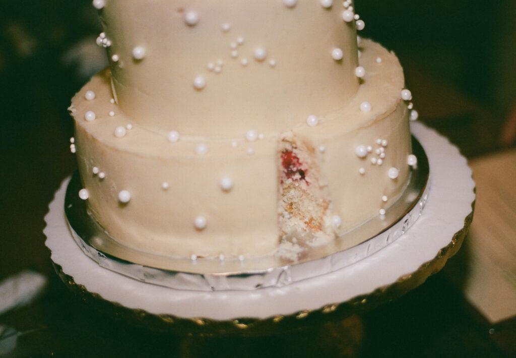 A candid photo of a wedding cake from an intimate wedding in new york city captured on 35mm film