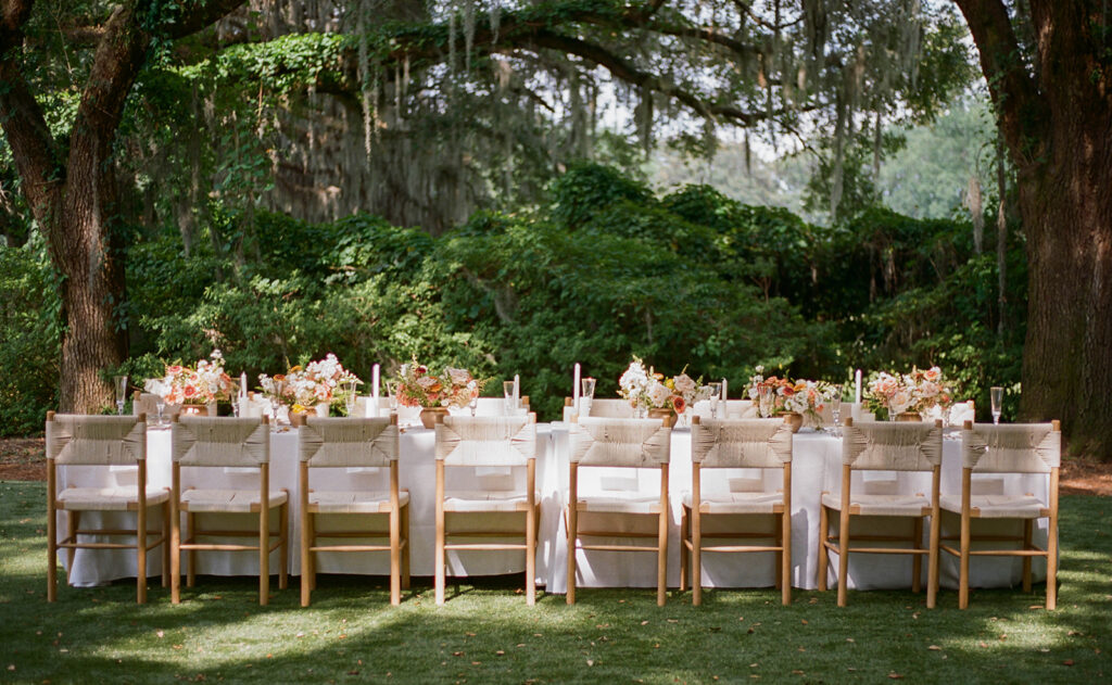 Table scape details from a destination Charleston, South Carolina garden party wedding on film. Discover luxury and timeless wedding photos on 35mm film.