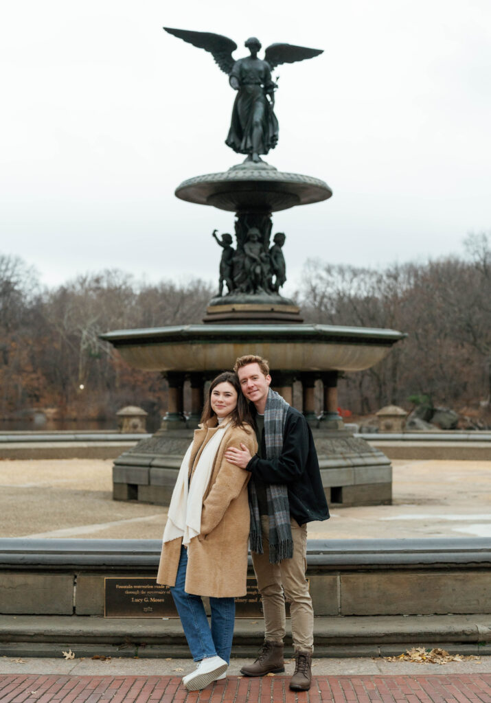 A couple wandering around Bethesda Fountain in Central Park together. Discover candid engagement photos in New York City. 