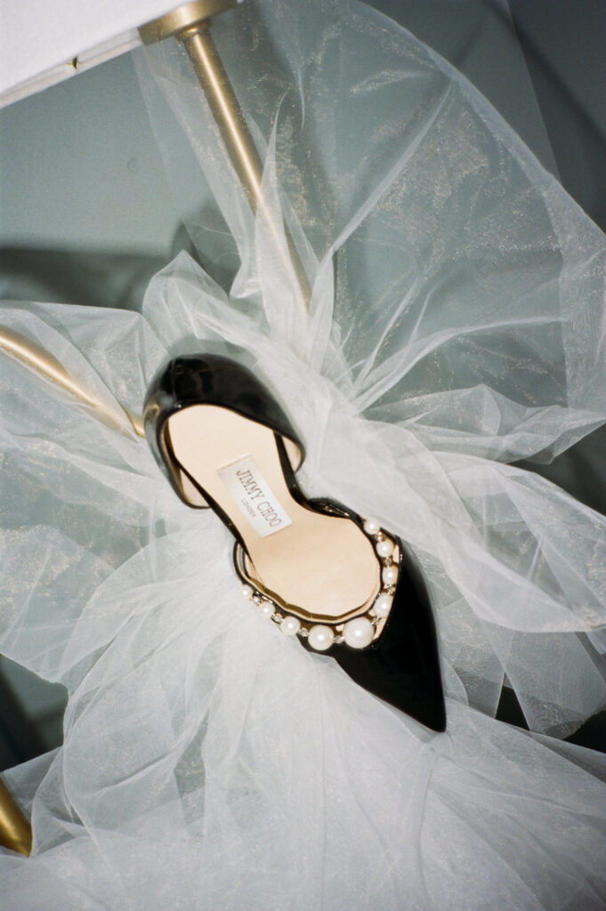 a unique detail photo of jimmy choo heels captured on film by a new york city wedding photographer 