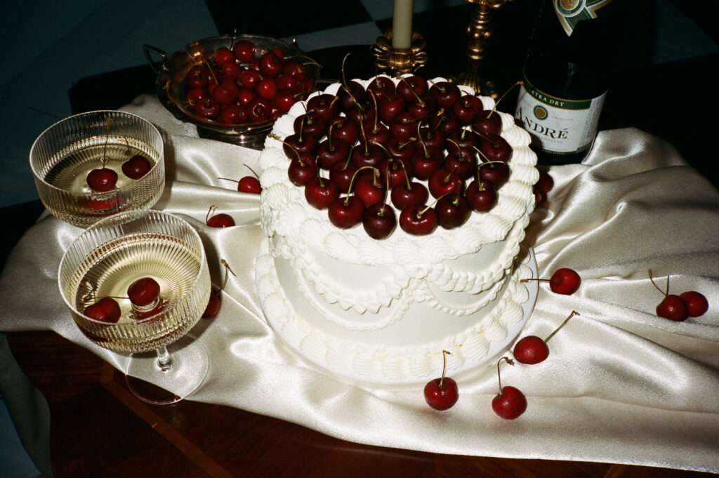 a vintage cherry wedding cake captured on 35mm by a new york city wedding photographer 