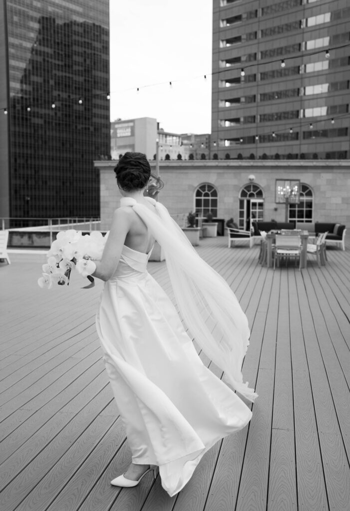 An elegant and timeless bride at her downtown Dallas, Texas wedding at the 400 N Ervay wedding venue. Discover candid, editorial, documentary wedding photography on digital and film. 