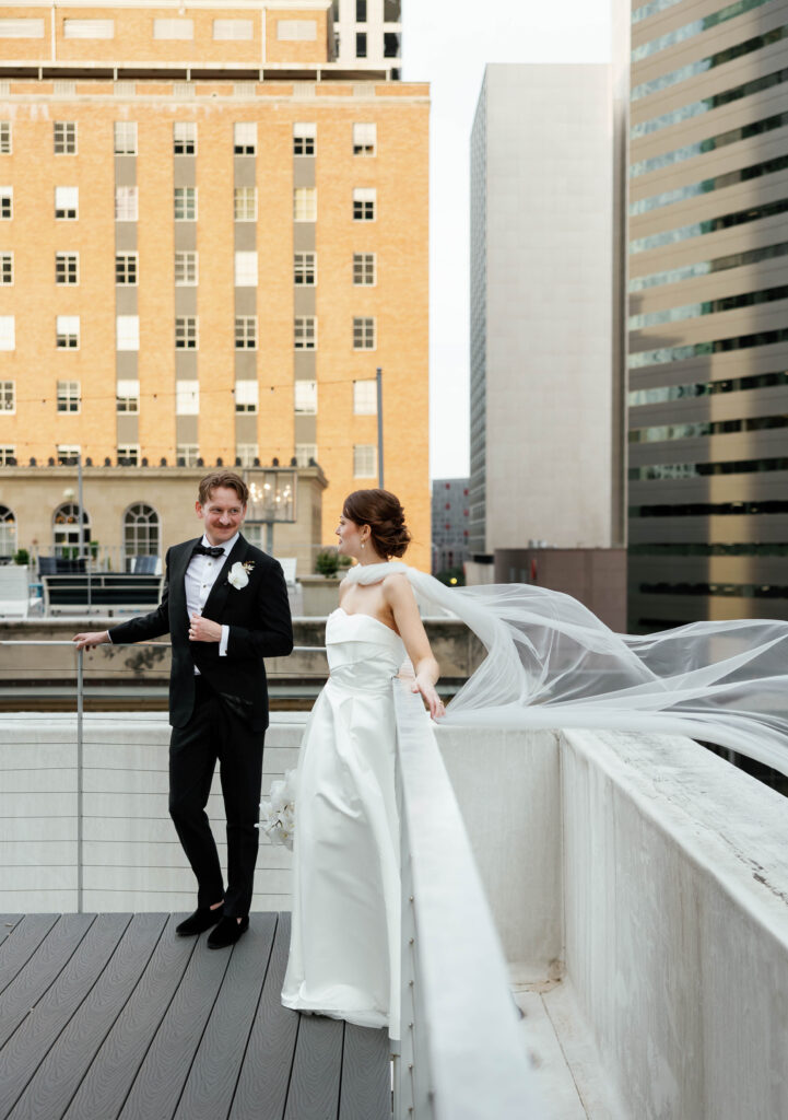 An elegant and timeless bride and groom at their downtown Dallas, Texas wedding at the 400 N Ervay wedding venue. Discover candid, editorial, documentary wedding photography on digital and film. 