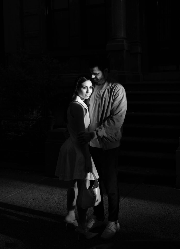 Fashionable bride-to-be in Jimmy Choos and Gucci purse during NYC engagement session. Discover candid couples photography in New York City. 