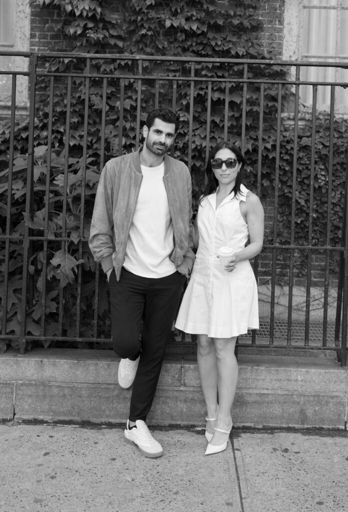 Modern and stylish couple poses on the streets of Greenwich Village in NYC. Discover documentary and fashionable New York City engagement photos. 