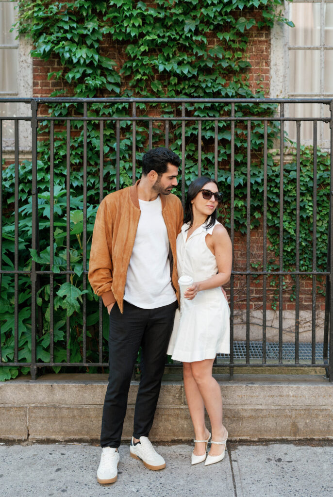 Modern and stylish couple poses on the streets of Greenwich Village in NYC. Discover documentary and fashionable New York City engagement photos. 