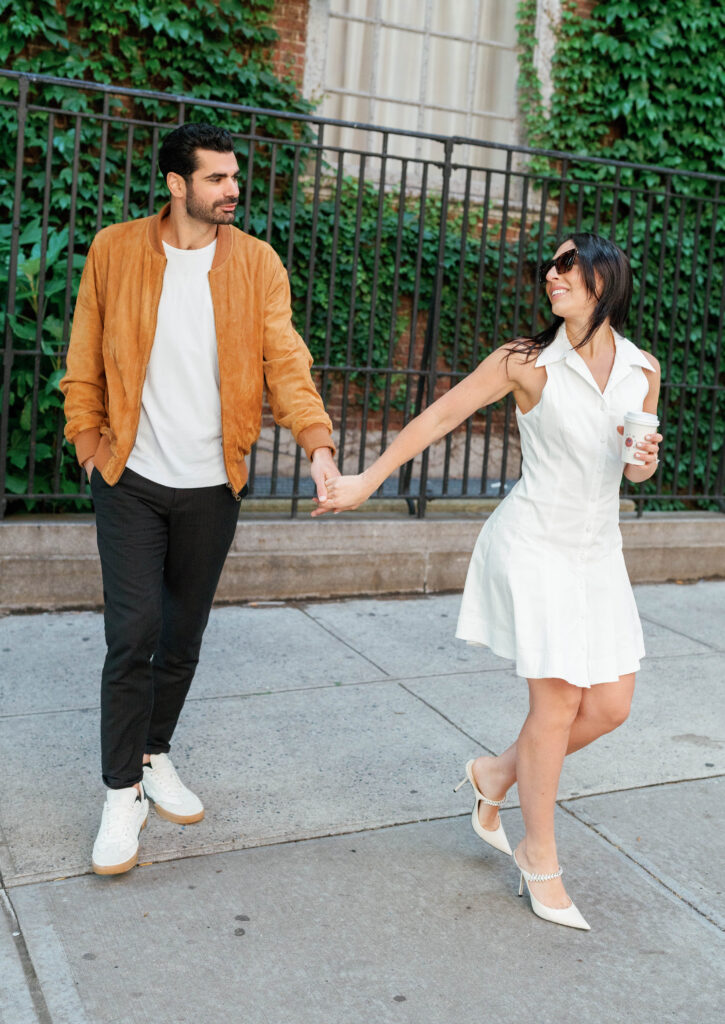 Modern and stylish couple poses on the streets of Greenwich Village in NYC. Discover documentary and fashionable New York City engagement photos. 