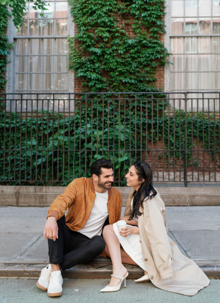 Modern and stylish couple poses on the streets of Greenwich Village in NYC. Discover documentary and fashionable New York City engagement photography. 