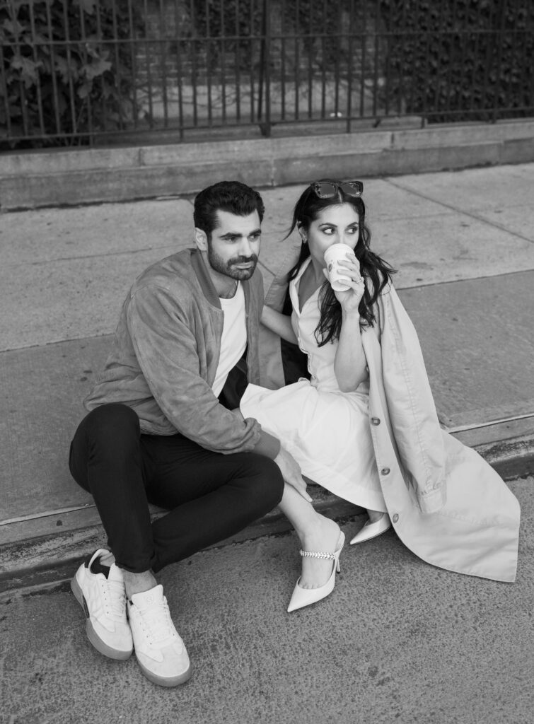 Modern and stylish couple poses on the streets of Greenwich Village in NYC. Discover documentary and fashionable New York City engagement photography. 