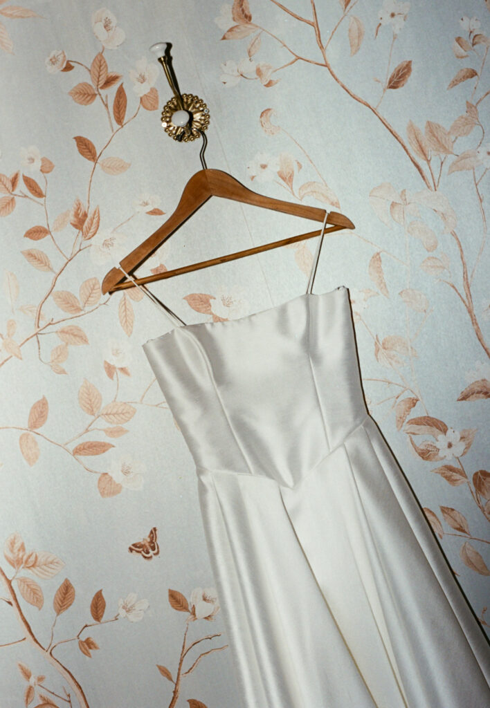 A photo of a wedding dress on 35mm film. Discover editorial film wedding photography in New York City and worldwide.