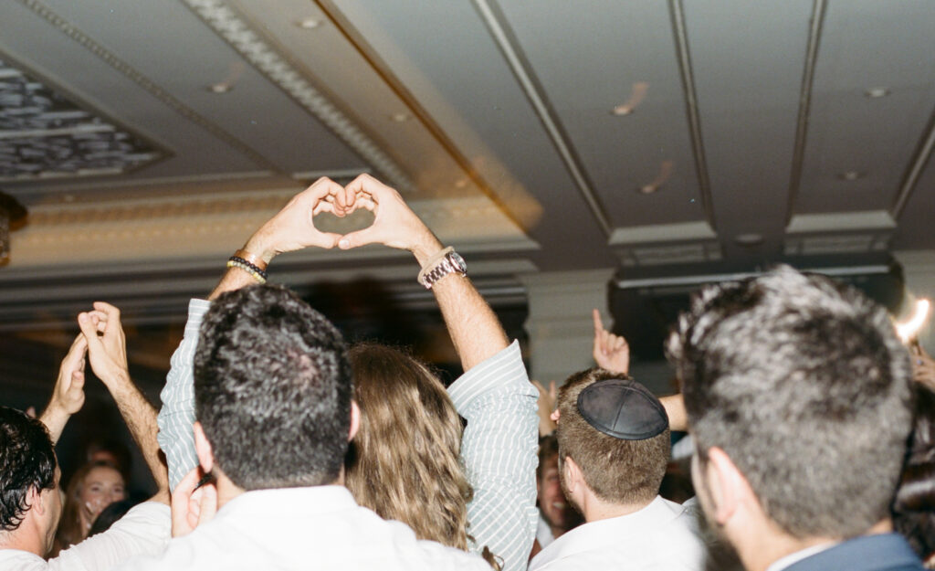 A candid photo of a wedding dance floor. Discover destination documentary and editorial film wedding photography.