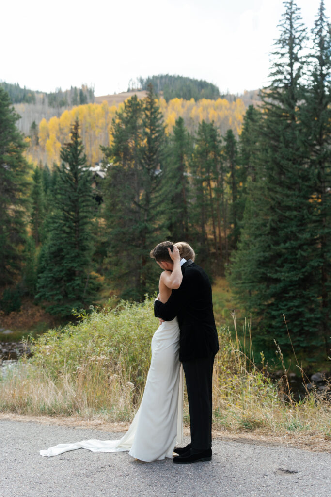A couple together at their fall wedding in Vail. Discover luxury editorial wedding photography in Colorado and beyond.  