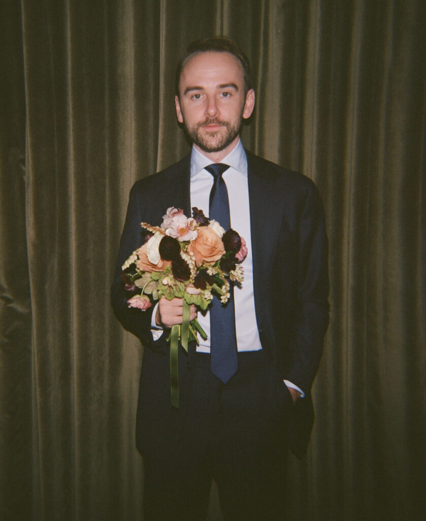 A couple gets ready at Nine Orchard hotel in Manhattan for the New York City Courthouse wedding at City Hall. Discover documentary and editorial wedding photography on film in NYC.