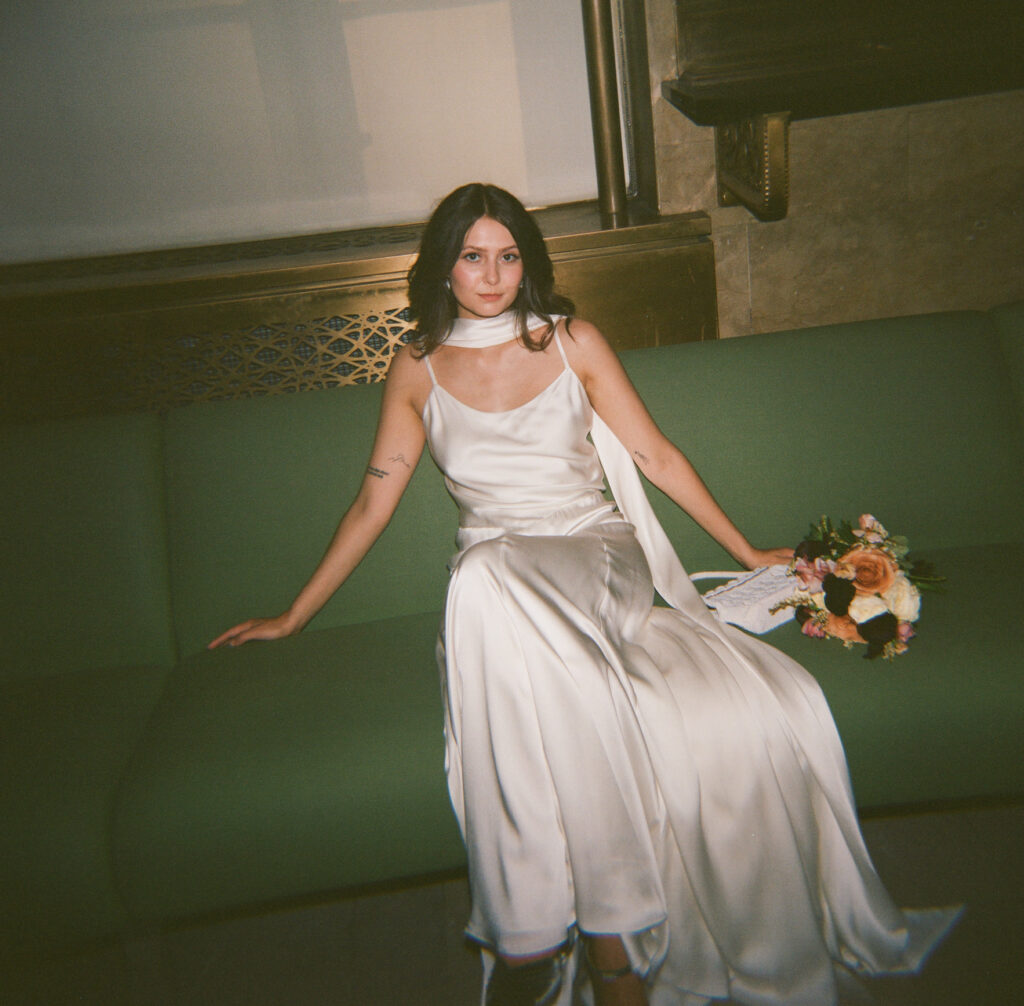 A bride in Manhattan City Hall for her New York City courthouse wedding. Discover documentary and editorial elopement film wedding photography in New York City.