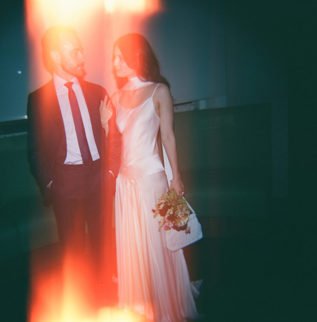 A couple in Manhattan City Hall for their New York City courthouse elopement. Discover a documentary and editorial film wedding photographer in New York City.
