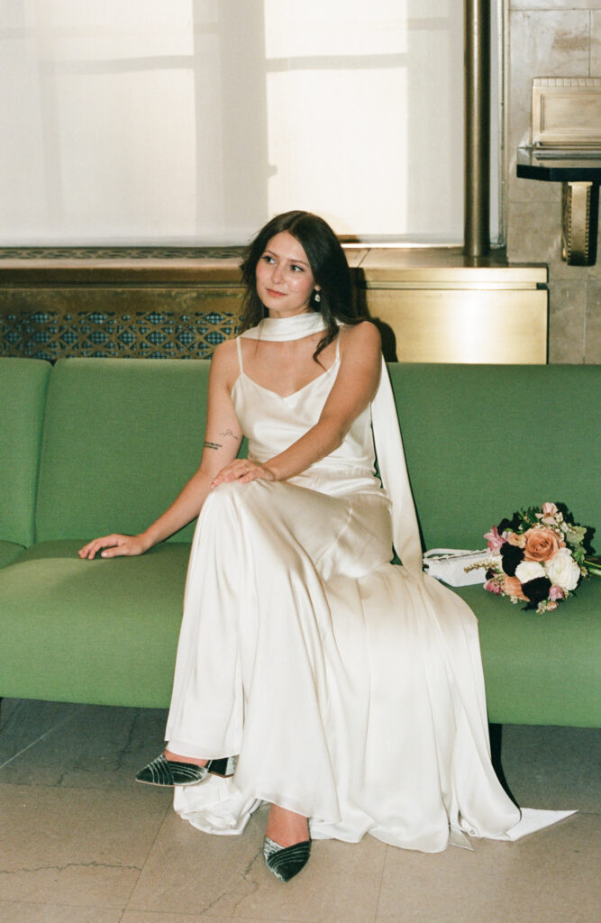 A bride in Manhattan City Hall for her New York City courthouse wedding. Discover documentary and editorial elopement film wedding photography in New York City.