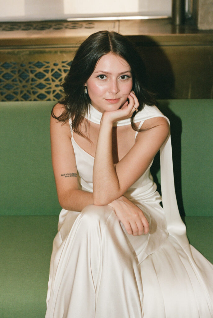 A bride in Manhattan City Hall for her New York City courthouse wedding. Discover documentary and editorial elopement film wedding photography in New York City.