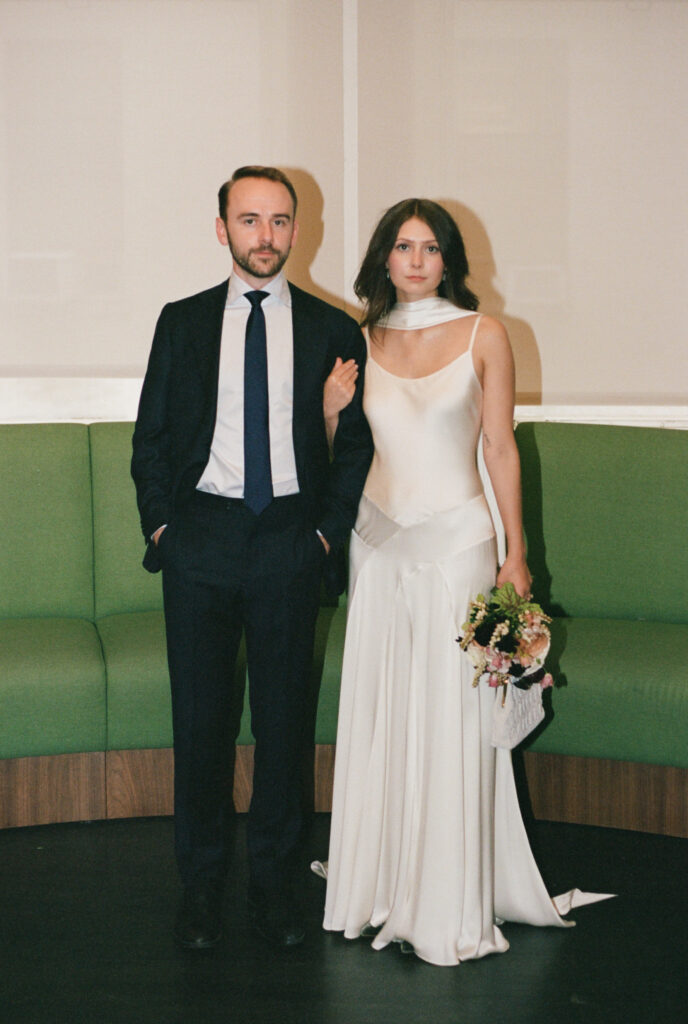 A couple in Manhattan City Hall for their New York City courthouse elopement. Discover a documentary and editorial film wedding photographer in New York City.