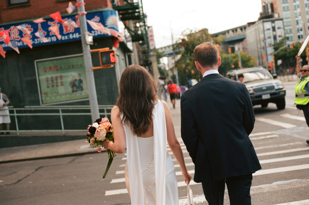 A couple in Manhattan for their New York City courthouse wedding. Discover documentary and editorial elopement and wedding photography in New York City on film.