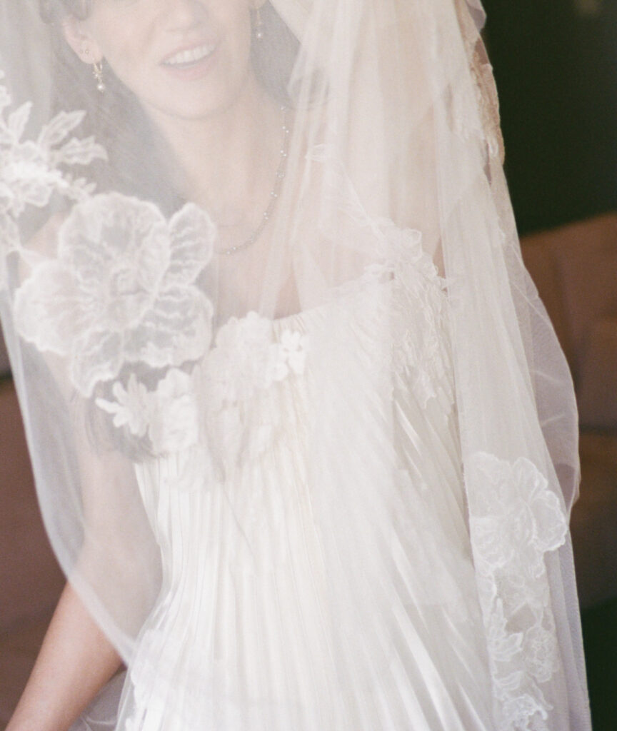 A bride gets ready for her wedding day in downtown Los Angeles, California. Discover film wedding photography in New York, Colorado, and California. 