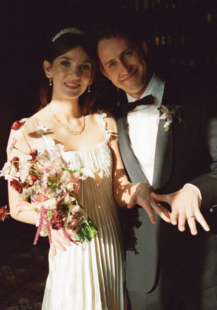 A couple poses for their wedding day in downtown Los Angeles, California. Discover film wedding photography in New York, Colorado, and California. 