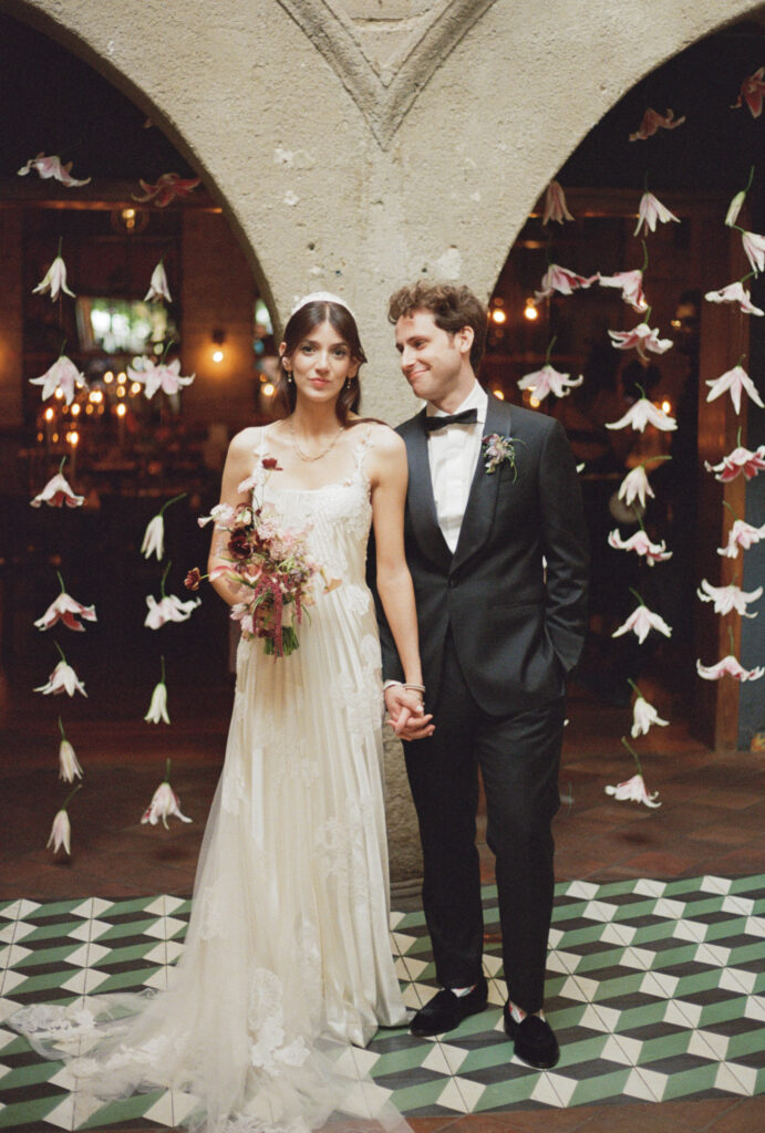 A couple poses for their wedding day in downtown Los Angeles, California. Discover film wedding photography in New York, Colorado, and California. 